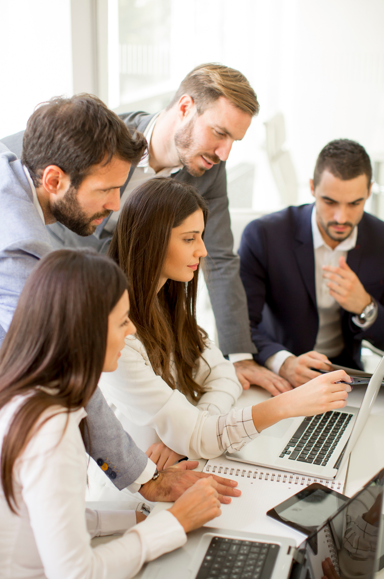Group leadership development at Accelus Partners - Texas leadership expert, coaches and speakers - team of professionals working together at a desk